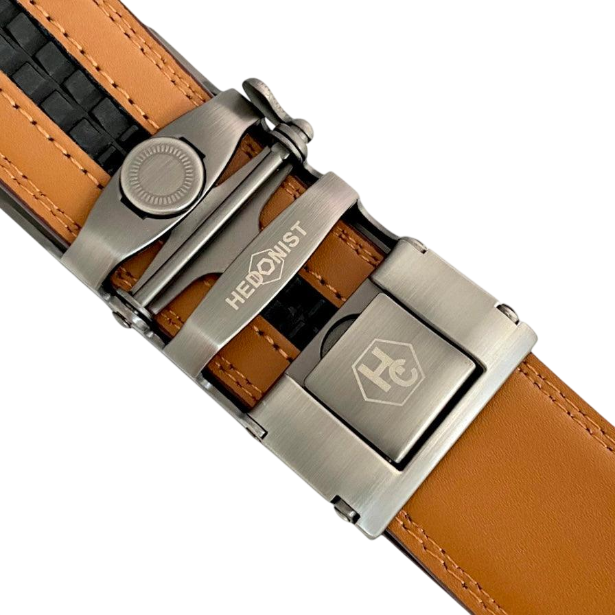 Red-brown leather ratchet belt with long gunmetal rectangle buckle, hardware close-up