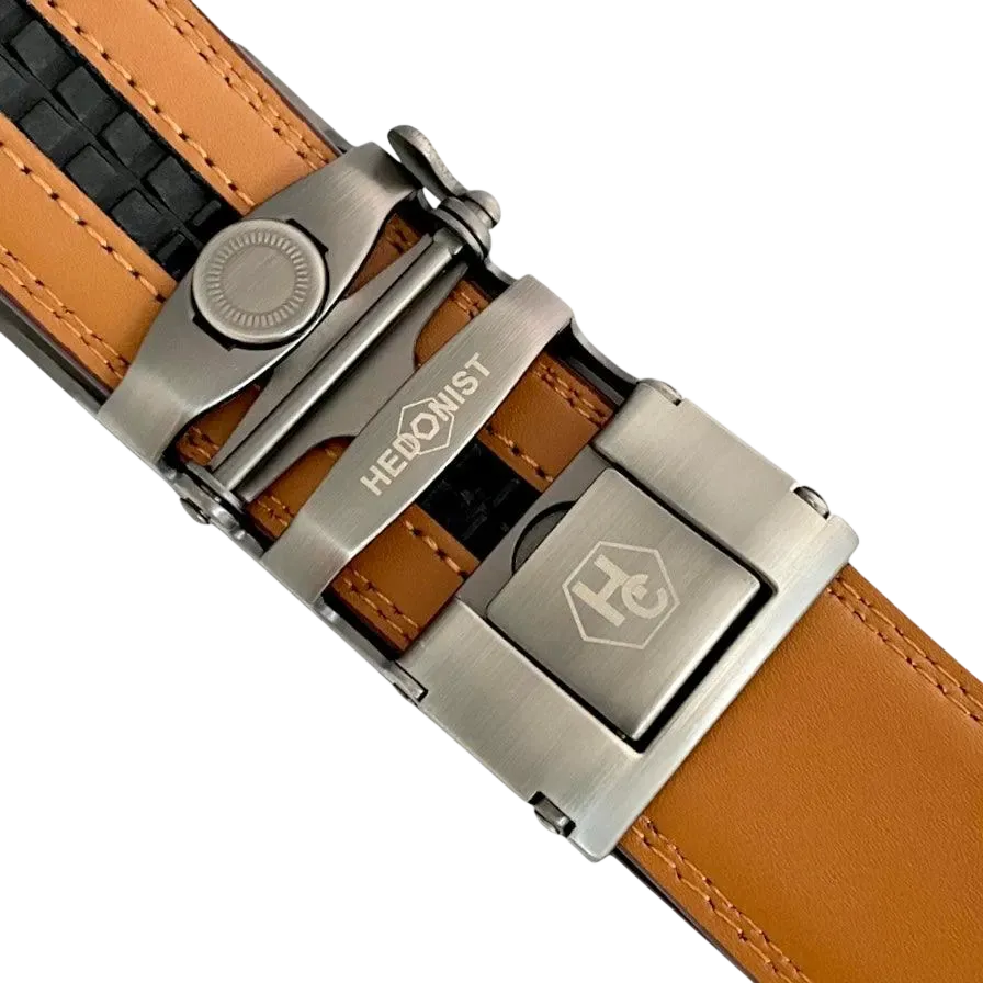 Red-brown leather ratchet belt with long gunmetal rectangle buckle, hardware close-up