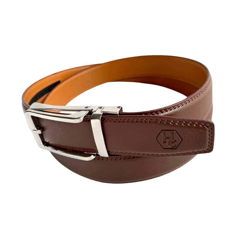 Red-brown leather ratchet belt with silver hollow buckle, buckle detail close-up