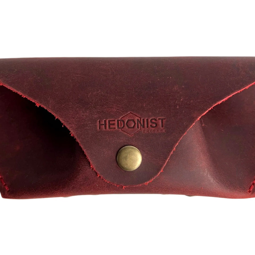 Soft Leather Eye Glasses Case in Red, closed, front view with embossed Hedonist logo and snap closure