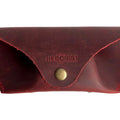 Soft Leather Eye Glasses Case in Red, closed, front view with embossed Hedonist logo and snap closure