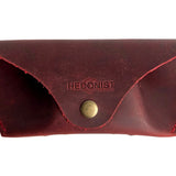 Soft Leather Eye Glasses Case in Red, closed, front view with embossed Hedonist logo and snap closure
