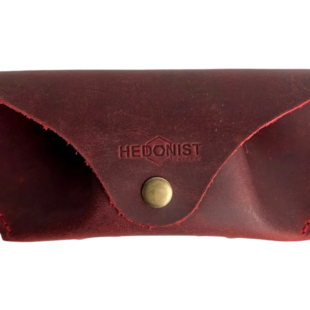 Soft Leather Eye Glasses Case in Red, closed, front view with embossed Hedonist logo and snap closure