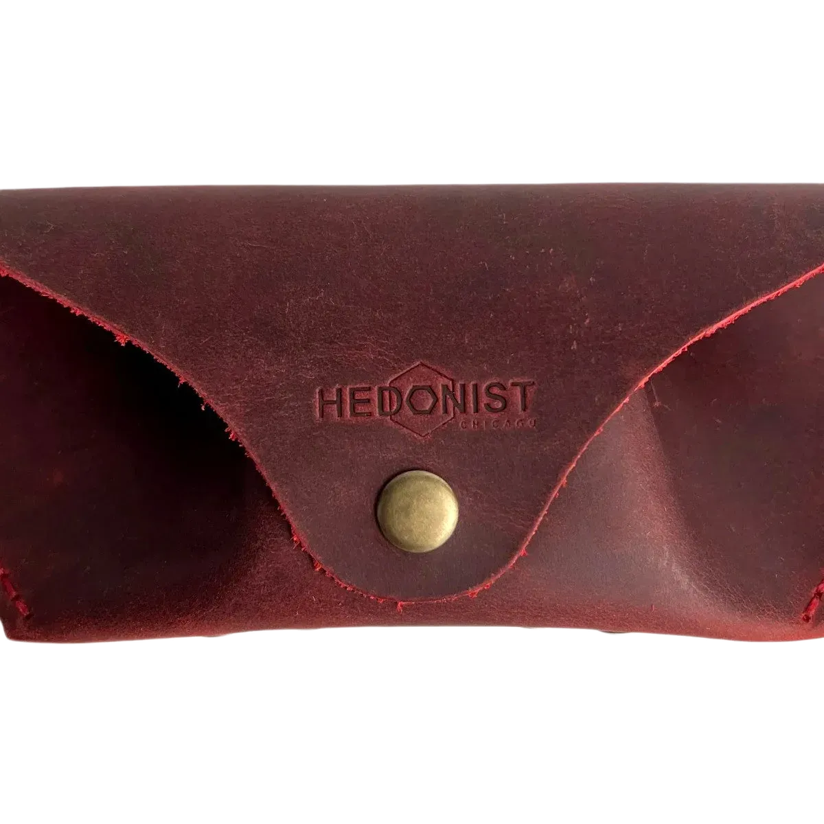 Soft Leather Eye Glasses Case in Red, closed, front view with embossed Hedonist logo and snap closure