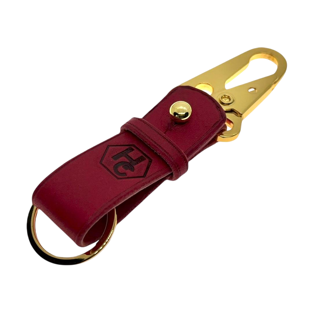 Red and gold leather key chain, full grain leather, angled view