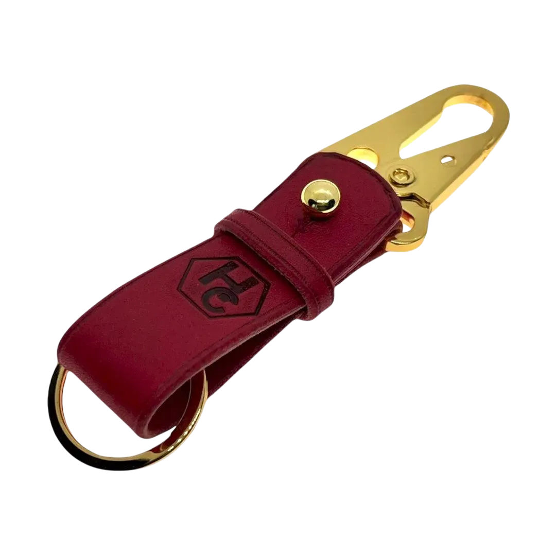 Red and gold leather key chain, full grain leather, angled view