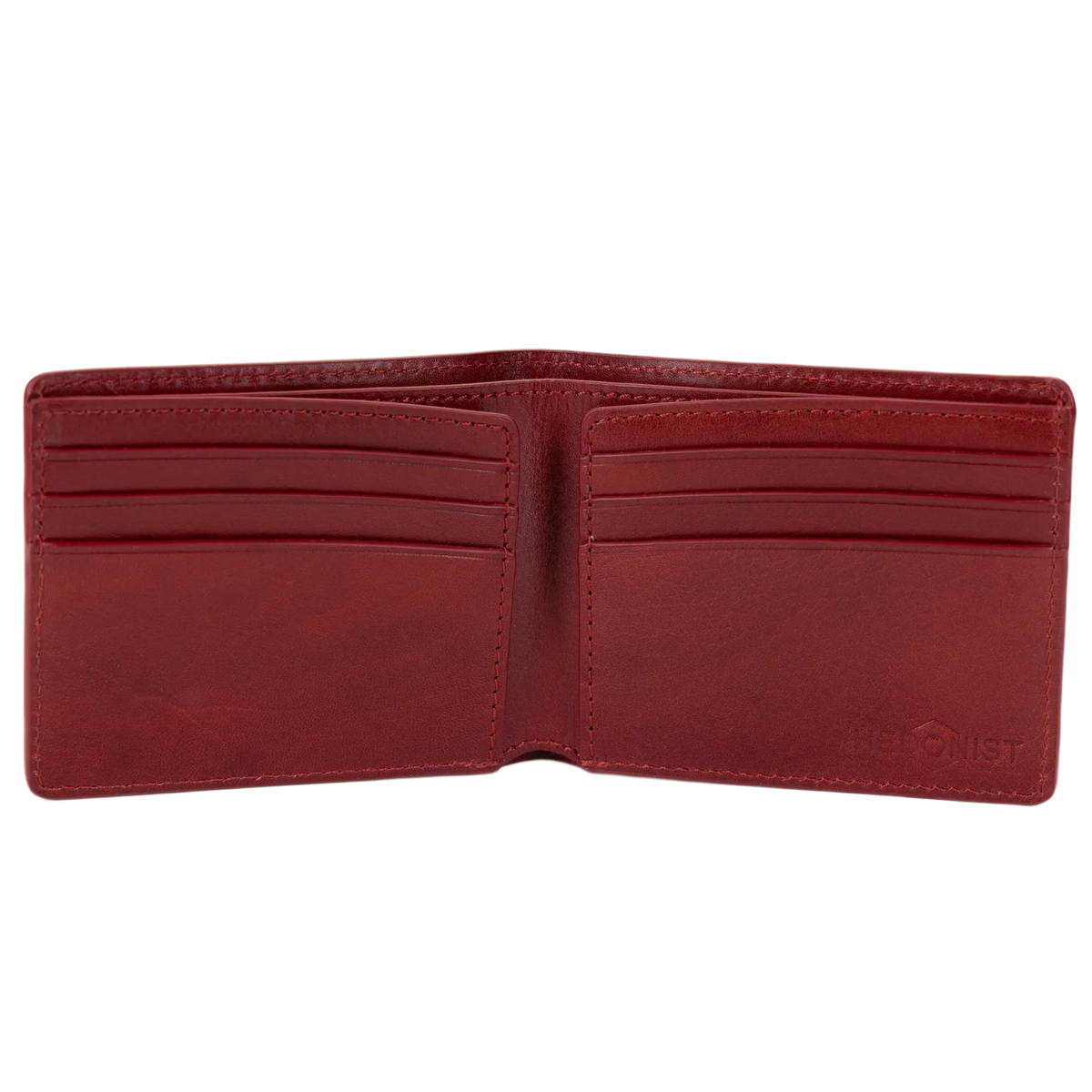 A red leather bifold wallet open at an angle, showing card slots and stitching detail