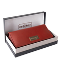 Red pebbled leather trifold wallet presented in Hedonist Chicago branded gift box
