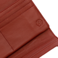 Close-up of red pebbled leather trifold wallet interior showing card slots and stitching detail