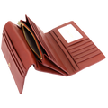 Red pebbled leather trifold wallet open showing card slots, zip compartment, and gold zipper pull