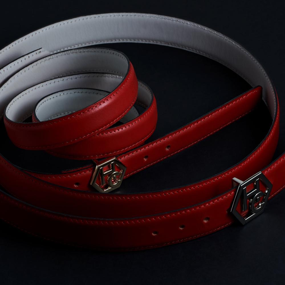 Side view on women's signature detail belt - red - Hedonist Chicago - close-up view (1", reversible with white)