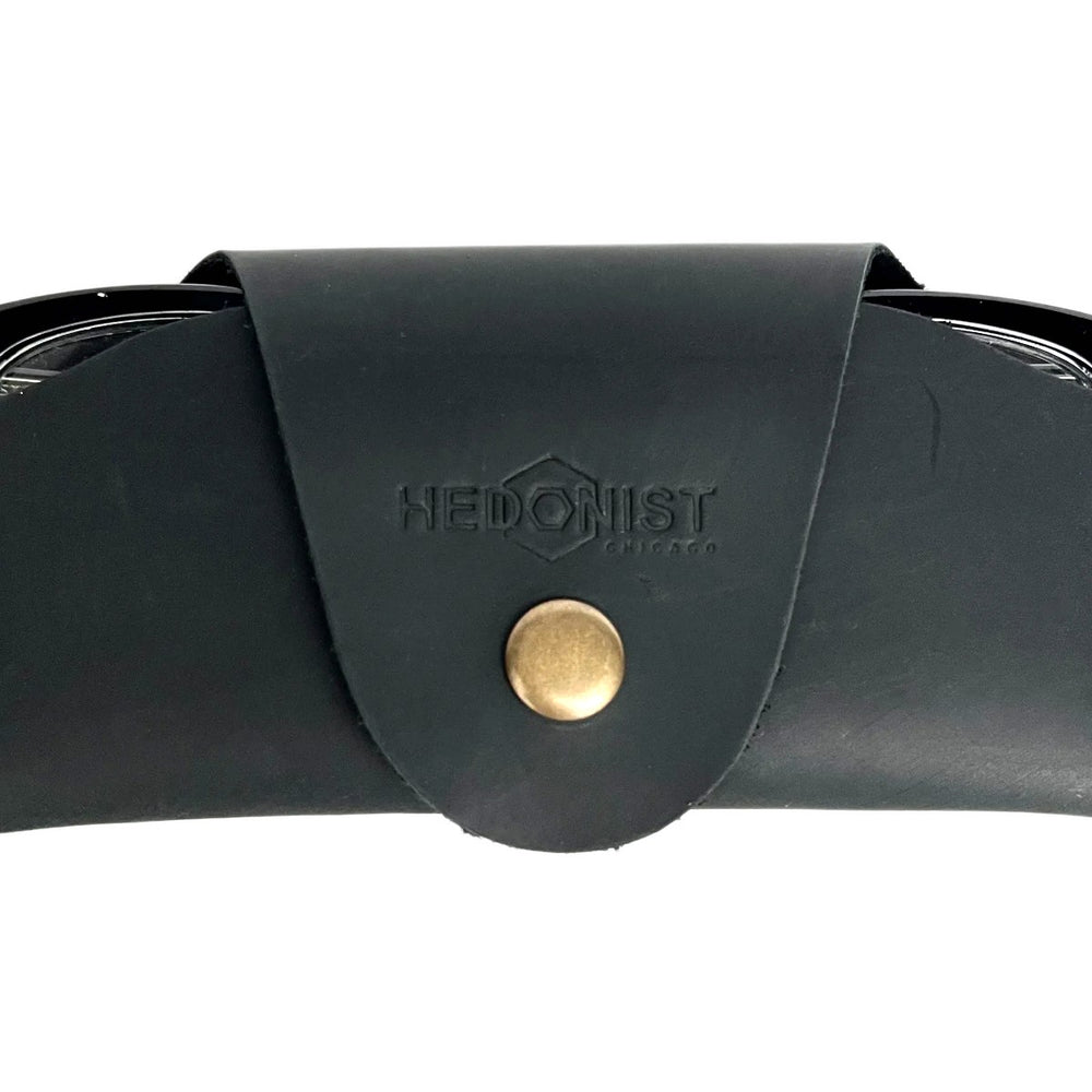 Small Soft Leather Eye Glasses Case in Black, closed, with sunglasses temples visible poking out both sides