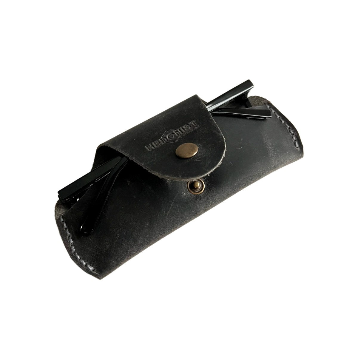 Small Soft Leather Eye Glasses Case in Black Washed, angled view with folded sunglasses tucked inside