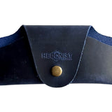 Small Soft Leather Eye Glasses Case in Navy Blue, closed, front view with embossed Hedonist logo and snap closure
