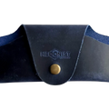 Small Soft Leather Eye Glasses Case in Navy Blue, closed, front view with embossed Hedonist logo and snap closure
