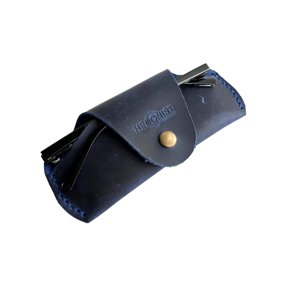 Small Soft Leather Eye Glasses Case in Navy Blue, angled view with sunglasses temples visible poking out