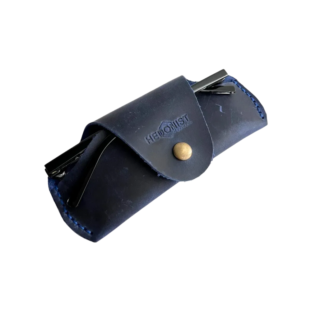 Small Soft Leather Eye Glasses Case in Navy Blue, angled view with sunglasses temples visible poking out