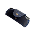 Small Soft Leather Eye Glasses Case in Navy Blue, angled view with black-framed eyeglasses tucked inside