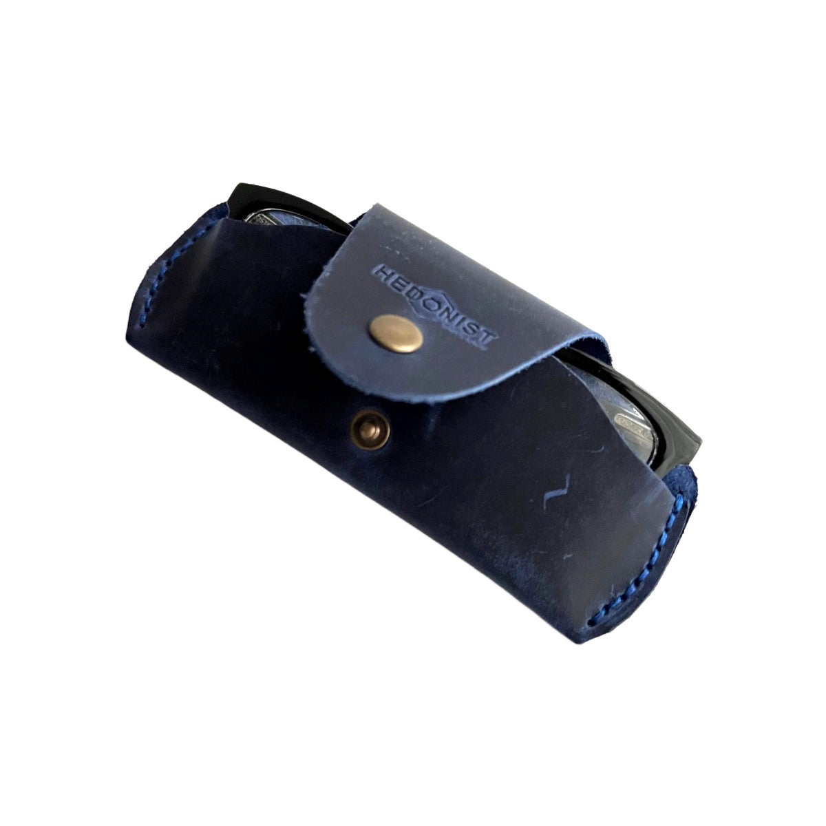 Small Soft Leather Eye Glasses Case in Navy Blue, angled view with black-framed eyeglasses tucked inside