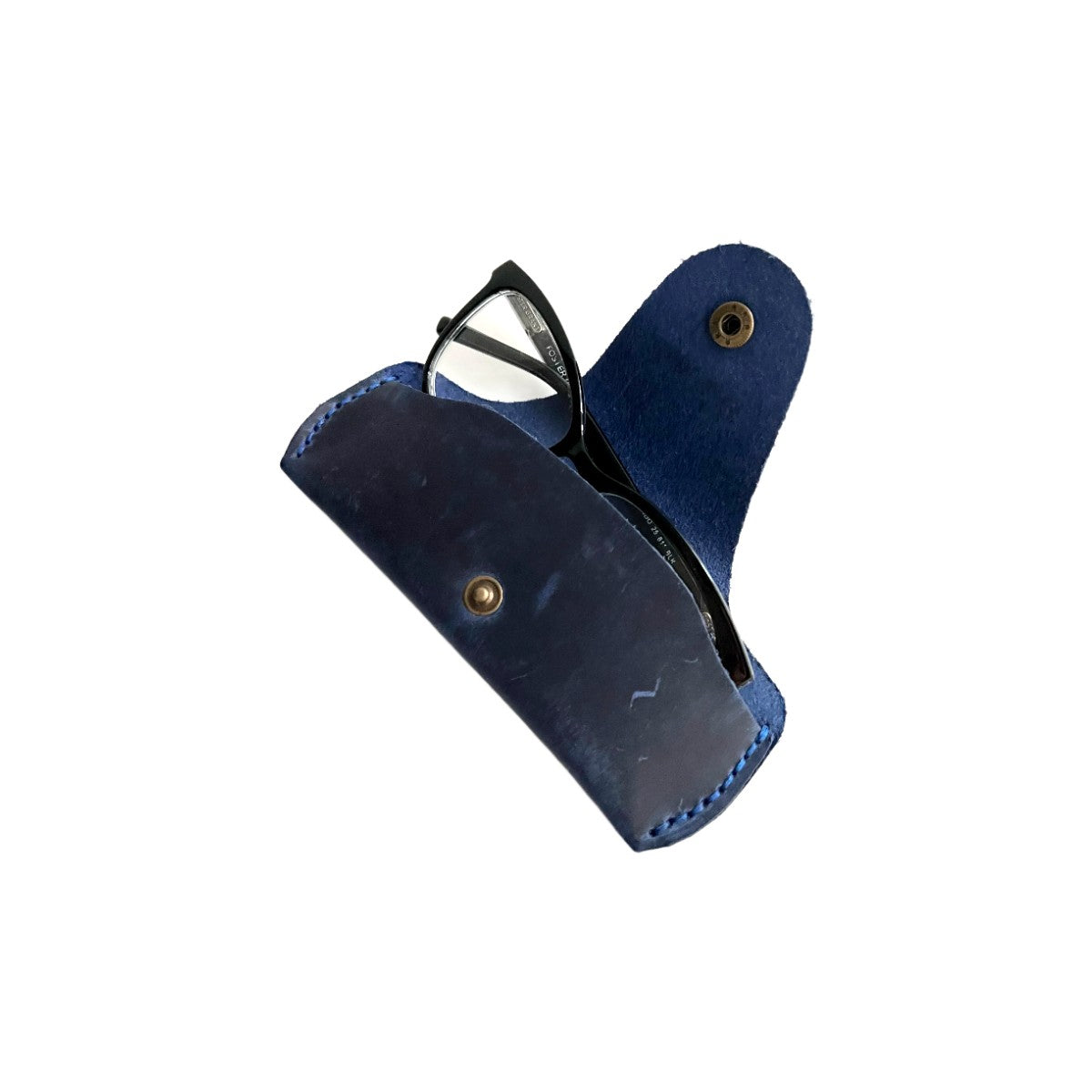 Small Soft Leather Eye Glasses Case in Navy Blue, open, angled top view with black-framed eyeglasses inside