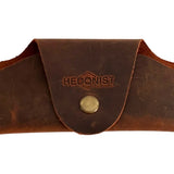 Small Soft Leather Eye Glasses Case in Brown, closed, front view with embossed Hedonist logo and snap closure