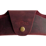 Small Soft Leather Eye Glasses Case in Burgundy, closed, front view with embossed Hedonist logo and snap closure
