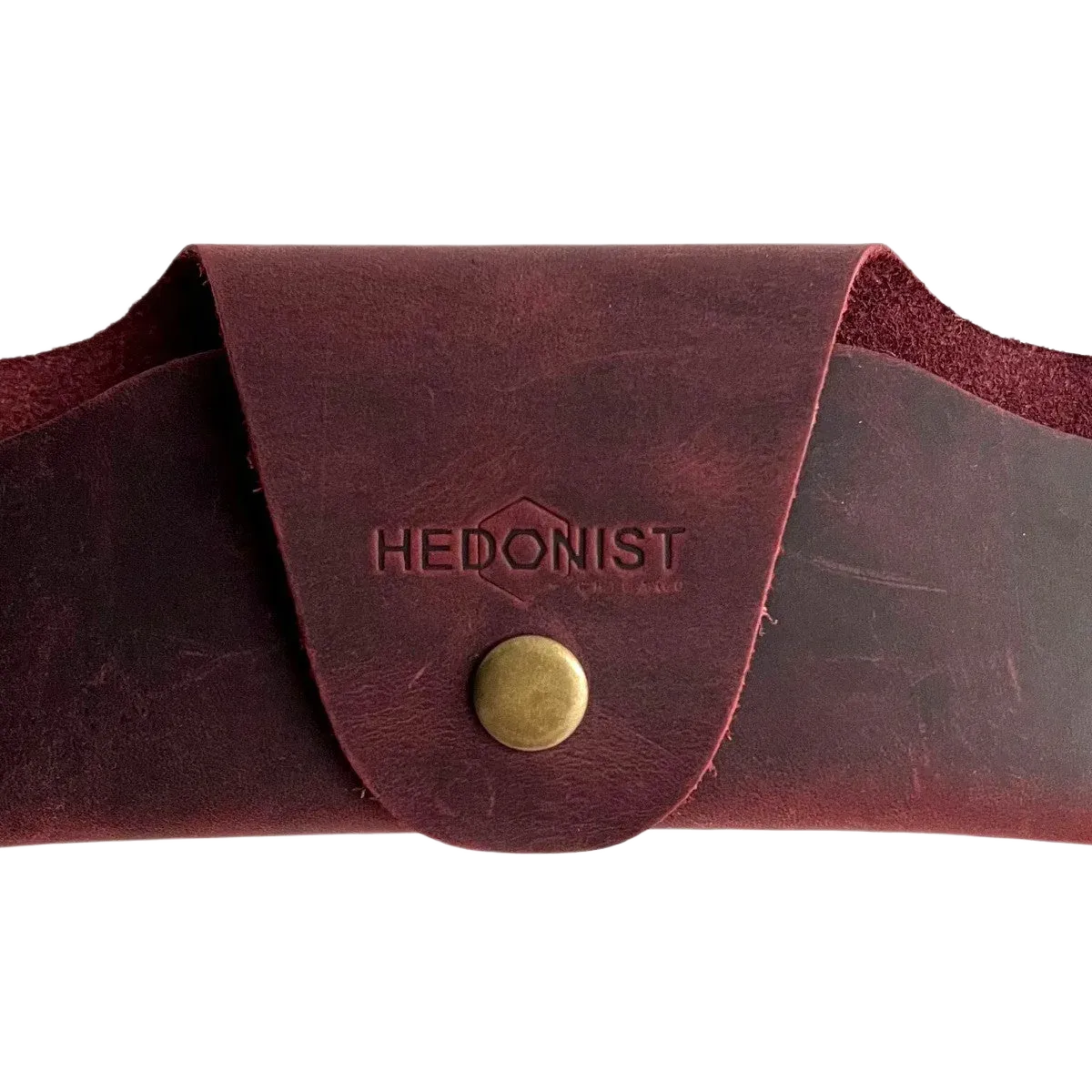 Small Soft Leather Eye Glasses Case in Burgundy, closed, front view with embossed Hedonist logo and snap closure