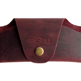 Small Soft Leather Eye Glasses Case in Burgundy, closed, front view with embossed Hedonist logo and snap closure