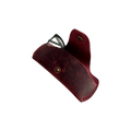 Small Soft Leather Eye Glasses Case in Burgundy, angled view with black-framed eyeglasses tucked inside