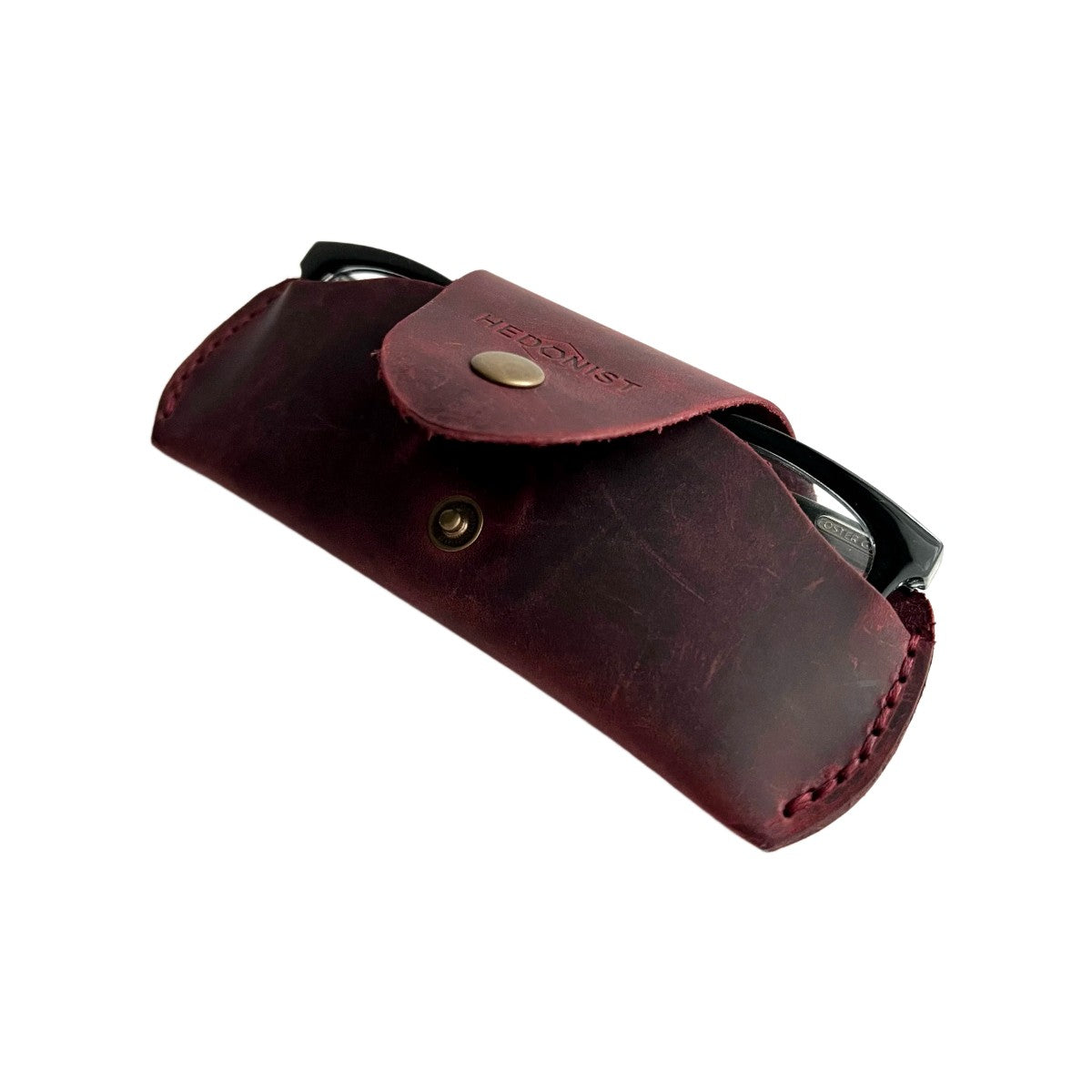 Small Soft Leather Eye Glasses Case in Burgundy, open, angled top view with black-framed eyeglasses inside