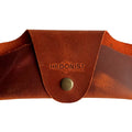 Small Soft Leather Eye Glasses Case in Cognac, closed, front view with embossed Hedonist logo and snap closure