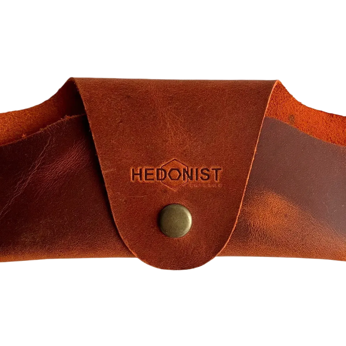 Small Soft Leather Eye Glasses Case in Cognac, closed, front view with embossed Hedonist logo and snap closure