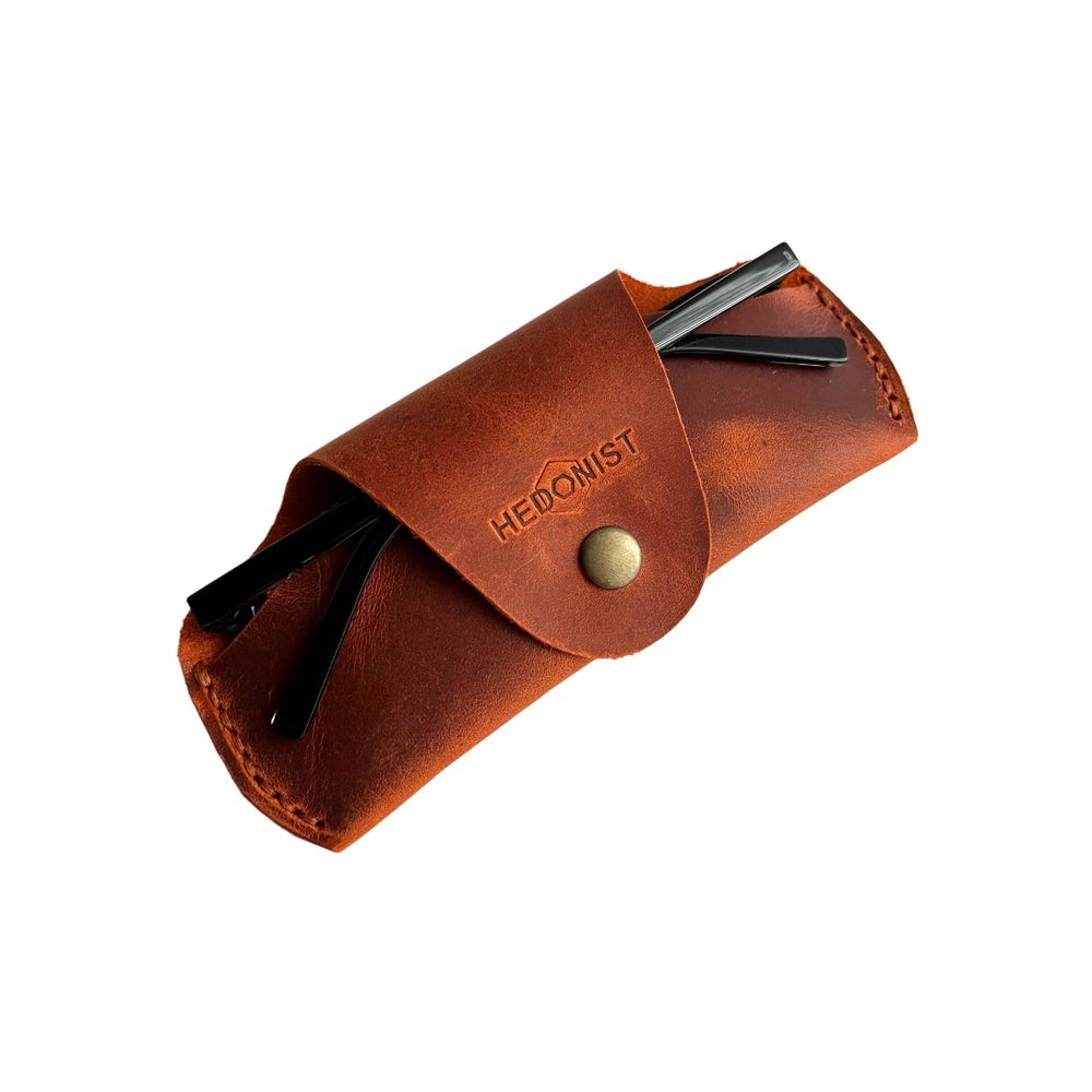 Small Soft Leather Eye Glasses Case in Cognac with folded sunglasses tucked inside, temples visible