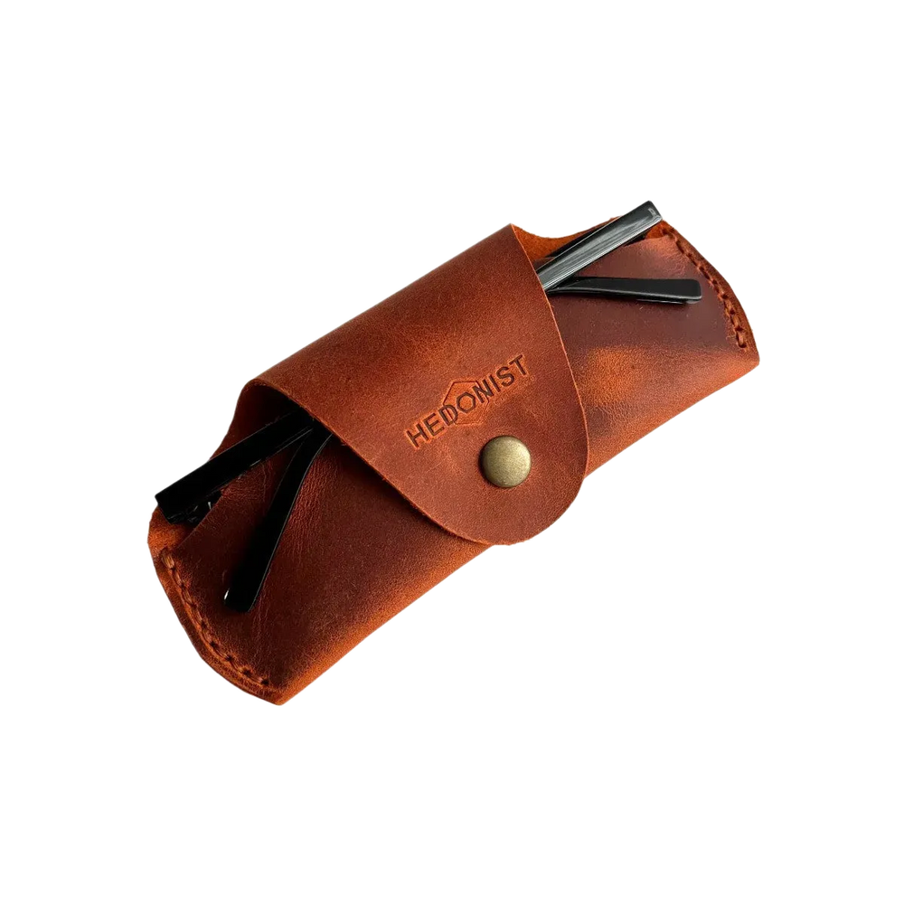 Small Soft Leather Eye Glasses Case in Cognac with folded sunglasses tucked inside, temples visible