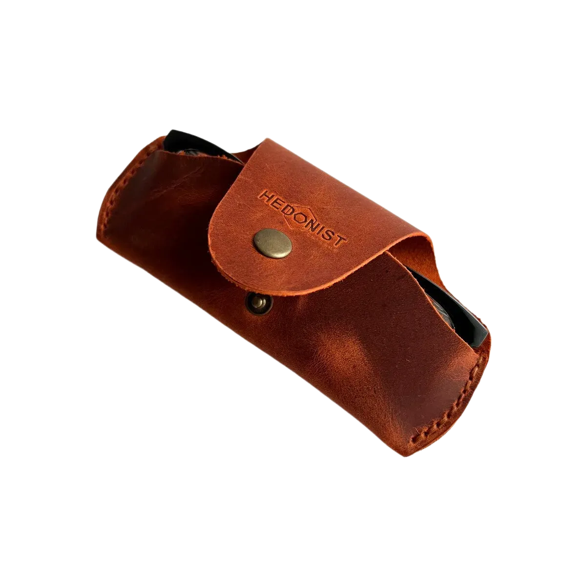 Small Soft Leather Eye Glasses Case in Cognac, angled view with folded sunglasses peeking out