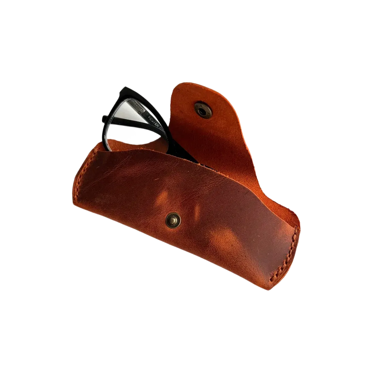 Small Soft Leather Eye Glasses Case in Cognac, open, with black-framed eyeglasses inside