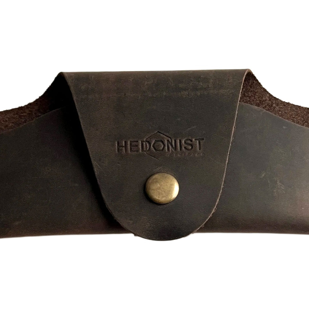 Small Soft Leather Eye Glasses Case in Dark Brown, closed, front view with embossed Hedonist logo and snap closure