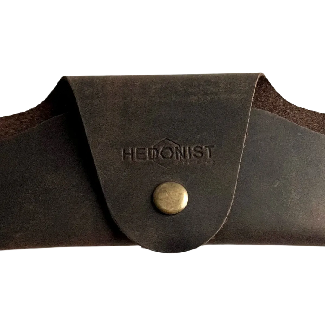 Small Soft Leather Eye Glasses Case in Dark Brown, closed, front view with embossed Hedonist logo and snap closure