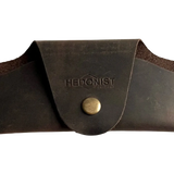 Small Soft Leather Eye Glasses Case in Dark Brown, closed, front view with embossed Hedonist logo and snap closure