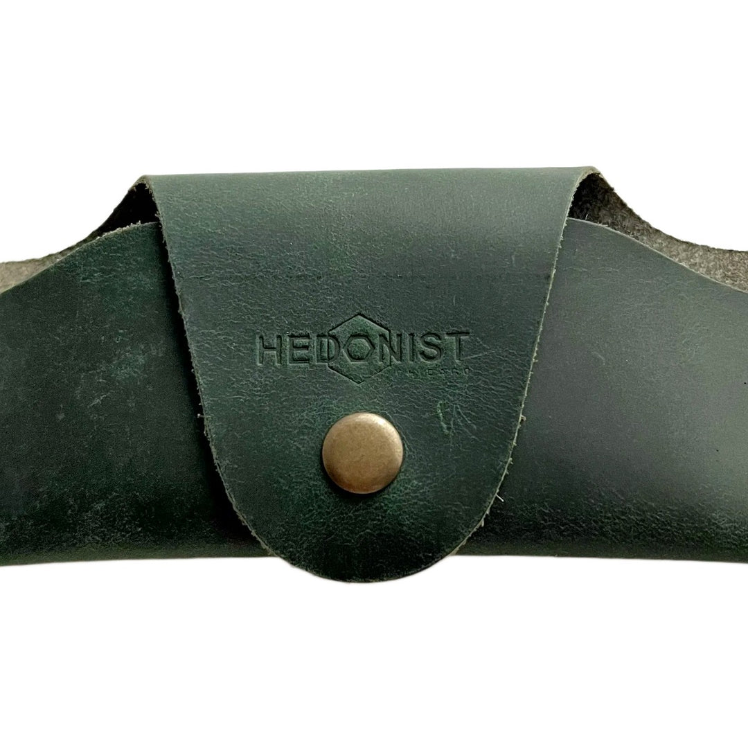 Small Soft Leather Eye Glasses Case in Dark Green, closed, front view with embossed Hedonist logo and snap closure