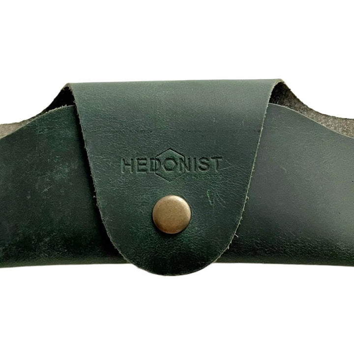 Small Soft Leather Eye Glasses Case in Dark Green, closed, front view with embossed Hedonist logo and snap closure