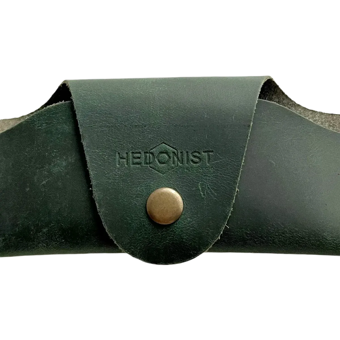 Small Soft Leather Eye Glasses Case in Dark Green, closed, front view with embossed Hedonist logo and snap closure