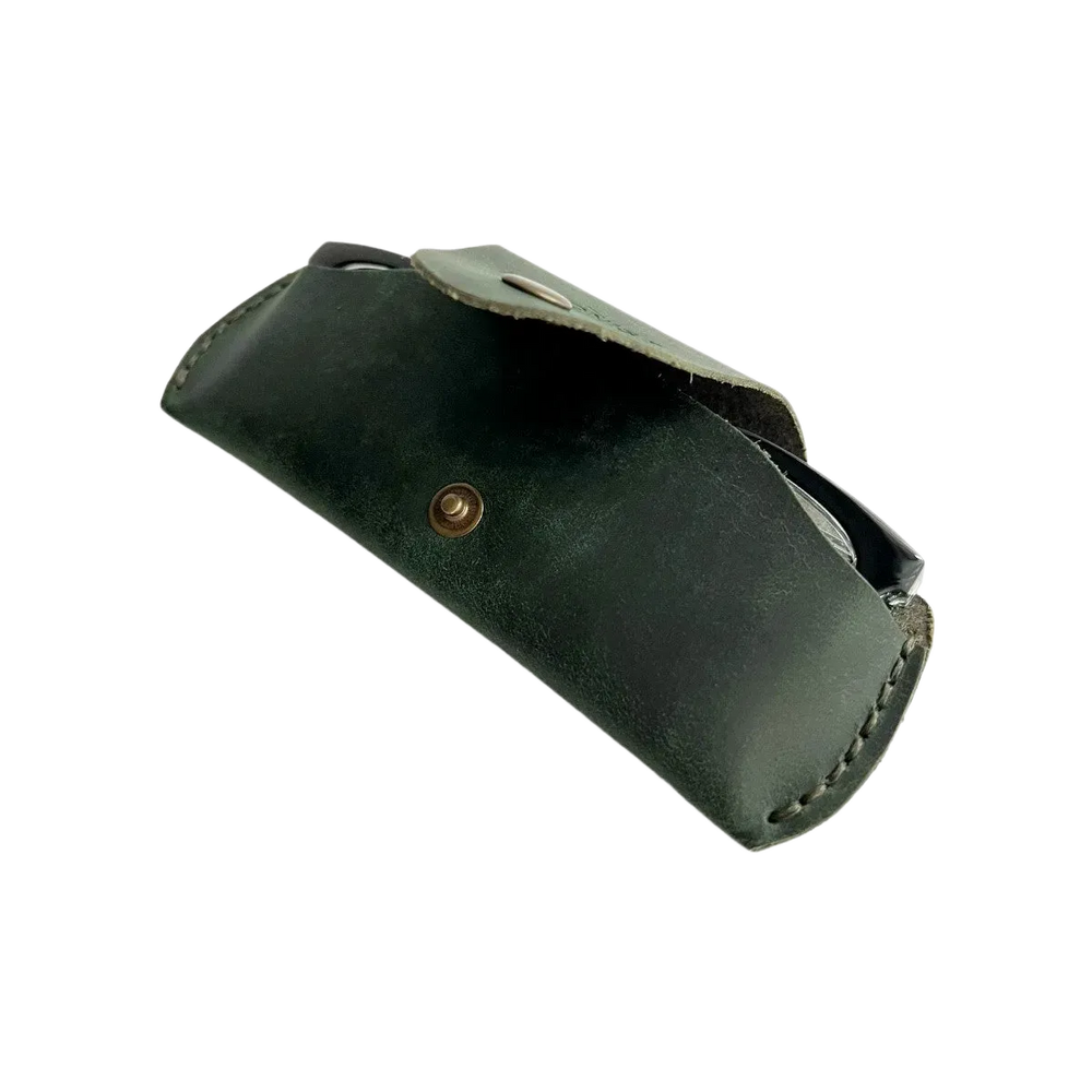 Small Soft Leather Eye Glasses Case in Dark Green, open, angled top view with black-framed eyeglasses inside