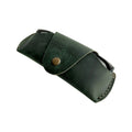 Small Soft Leather Eye Glasses Case in Dark Green, angled view with black-framed eyeglasses tucked inside