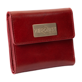 A red leather bi-fold wallet with a gold-tone metal brand plaque on the front flap.