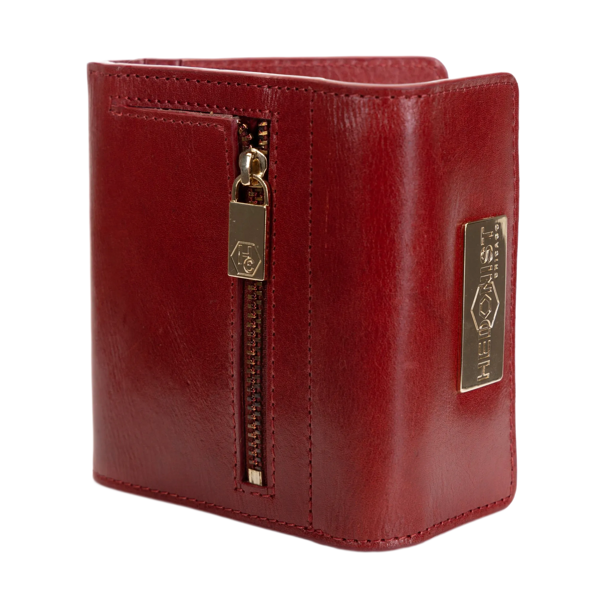 A red leather bifold wallet with a vertical zipper, gold-toned hardware, and a metal brand plaque on the side, shown against a plain white background.