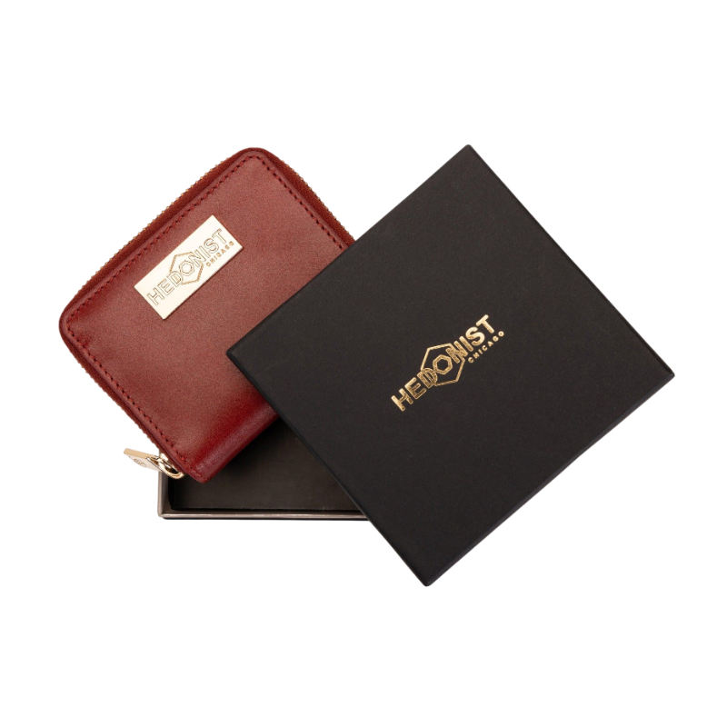 Small red zip-around leather wallet for women, presented as a gift