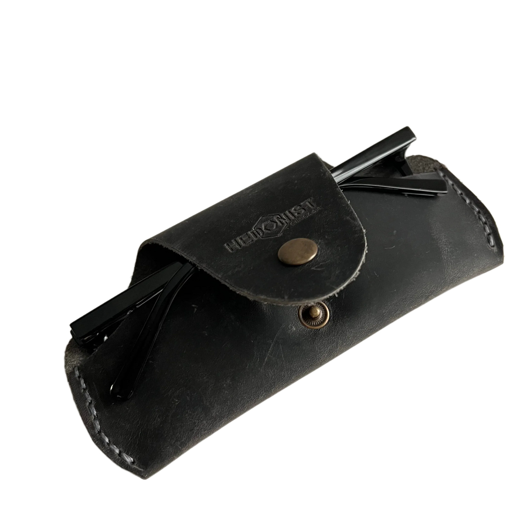 Small Soft Leather Eye Glasses Case in Black Washed, angled view with folded sunglasses tucked inside