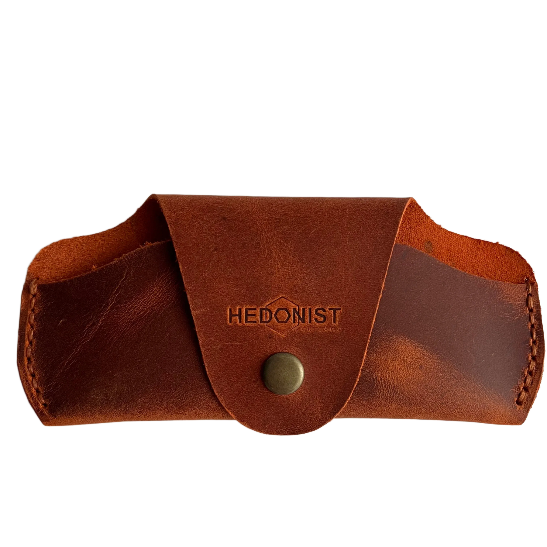 Small Soft Leather Eye Glasses Case in Cognac, closed, front view with embossed Hedonist logo and snap closure
