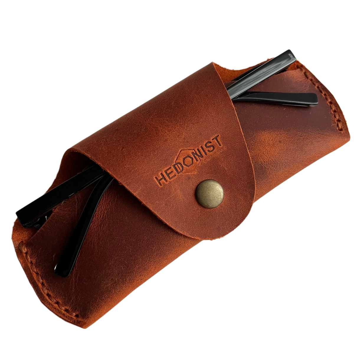 Small Soft Leather Eye Glasses Case in Cognac with folded sunglasses tucked inside, temples visible